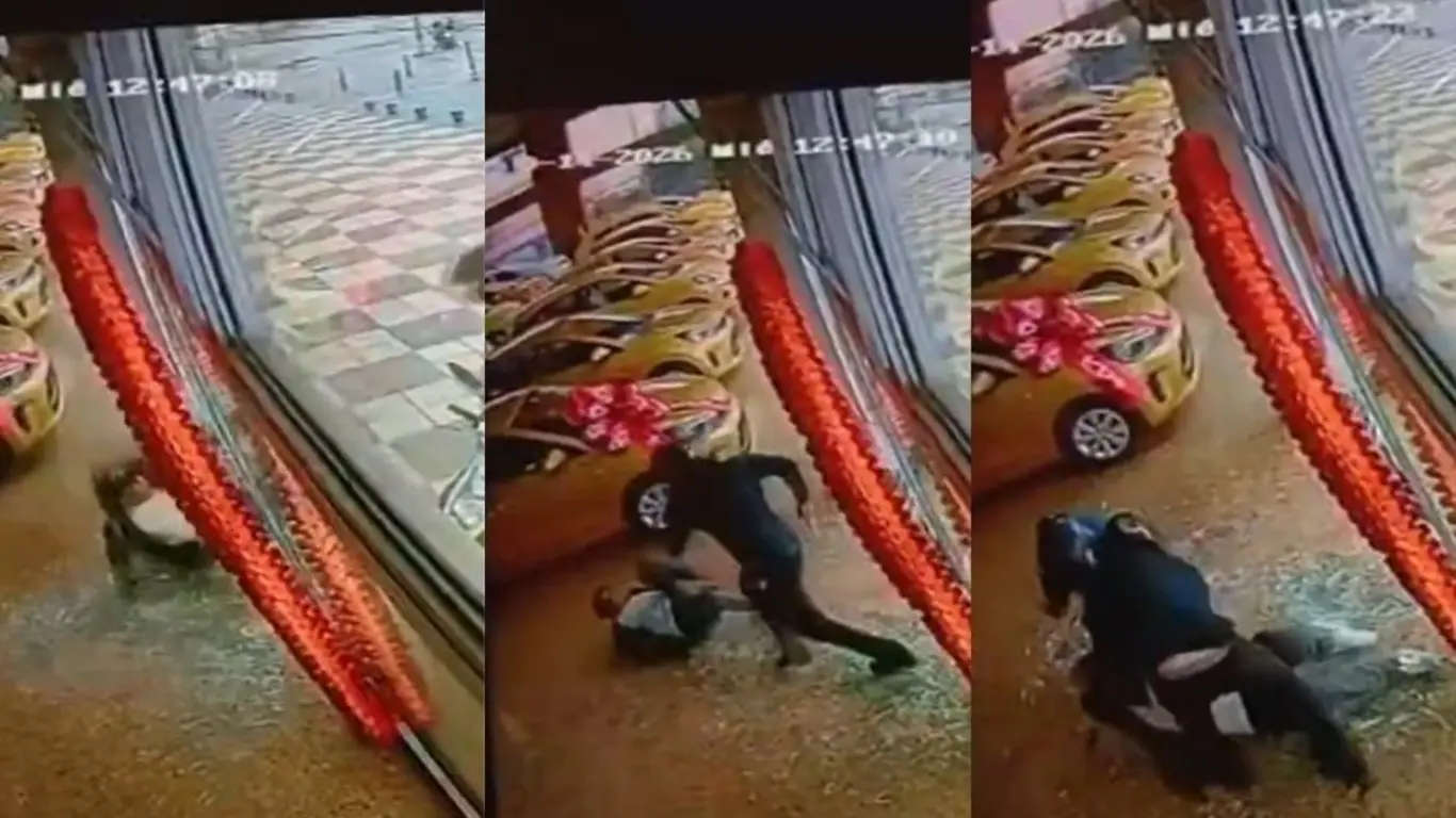 Hombre atraviesa vidrio de concesionario para escapar de intento de fleteo en Bogotá